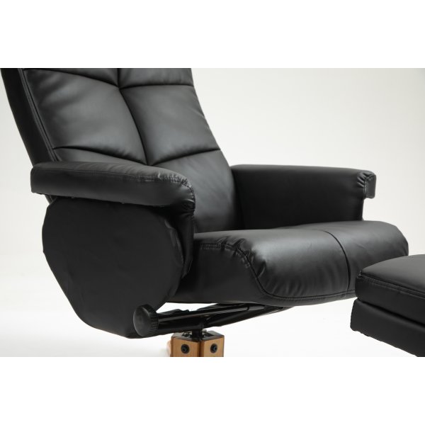 Duva Liegesessel mit Fuhocker aus schwarzem PU mit braunen Beinen