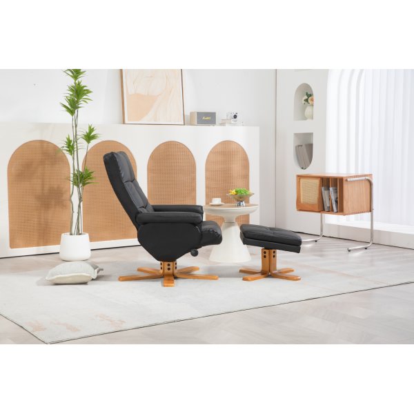 Duva Liegesessel mit Fuhocker aus schwarzem PU mit braunen Beinen