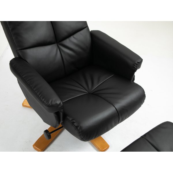 Duva Liegesessel mit Fuhocker aus schwarzem PU mit braunen Beinen